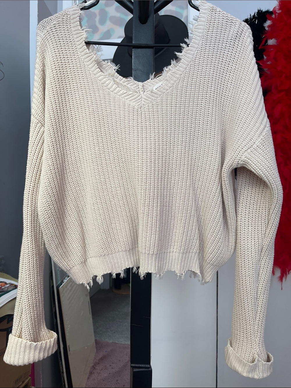 Moon & Madison cream-colored long sleeve distressed v-neck sweater